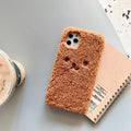 Brown embroidery plush cartoon bear face design on a flexible TPU iPhone phone case.
