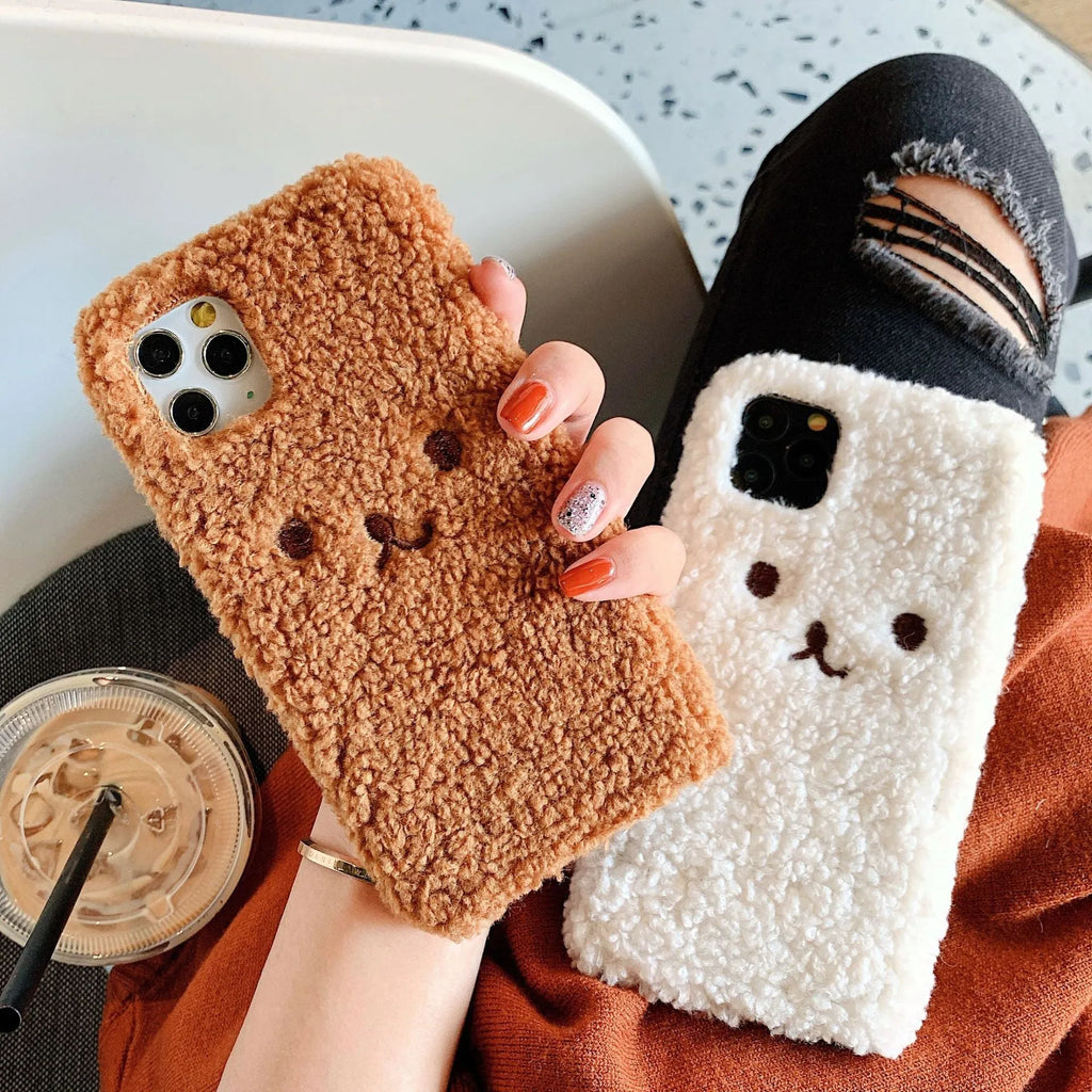 Brown embroidery plush cartoon bear face design on a flexible TPU iPhone phone case.