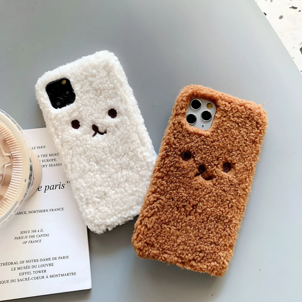 Brown embroidery plush cartoon bear face design on a flexible TPU iPhone phone case.