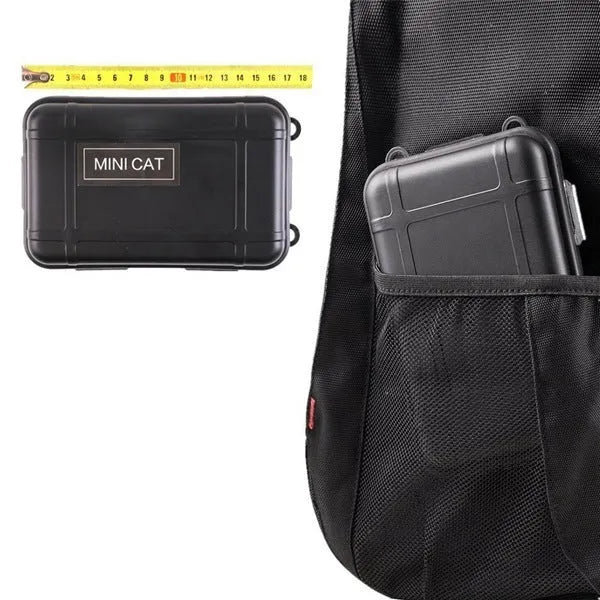 Black stainless steel survival kit box open to show 13 emergency tools including flashlight, compass, and survival blanket