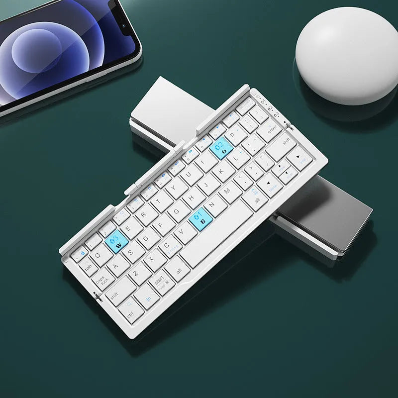 Silver white folding Bluetooth keyboard open beside smartphone showing aluminium stand
