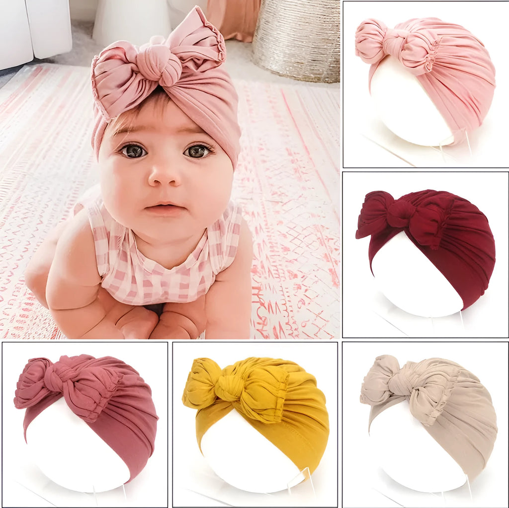 Soft acrylic knitted baby hat for newborn girls and toddlers in a pink colour.