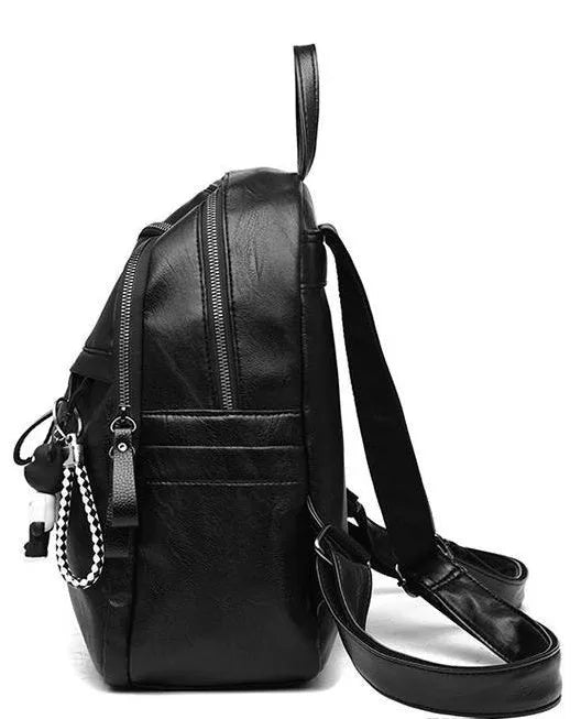 Black soft PU leather medium backpack showing double straps and luggage strap attachment