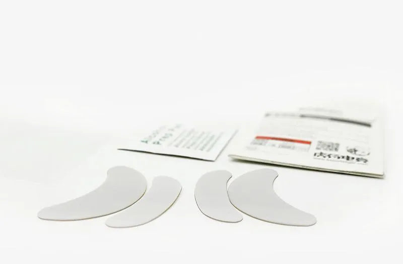 White Esports Tiger PTFE mouse skates for G PRO X Superlight on a neutral background with anti-static tweezers next to them