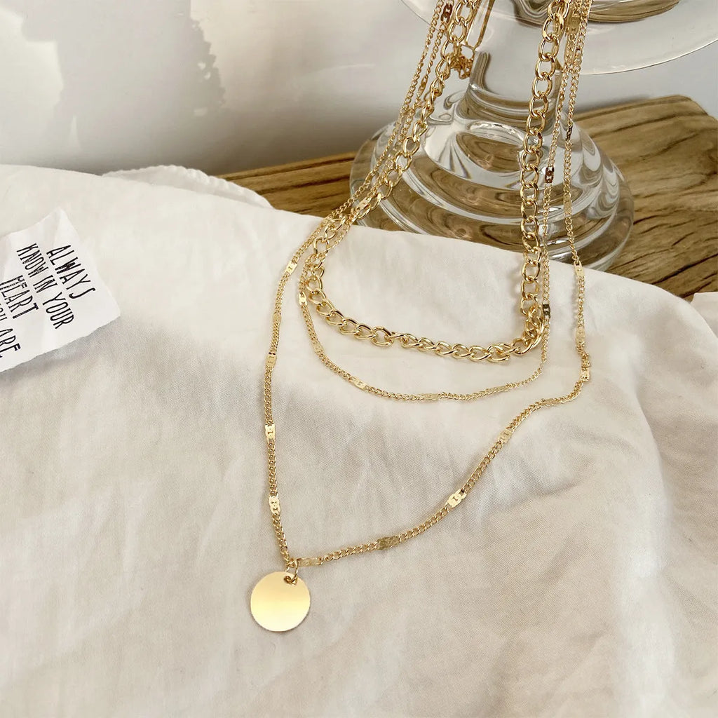 Women's multilayer disc pendant clavicle necklace in gold and silver alloy finish