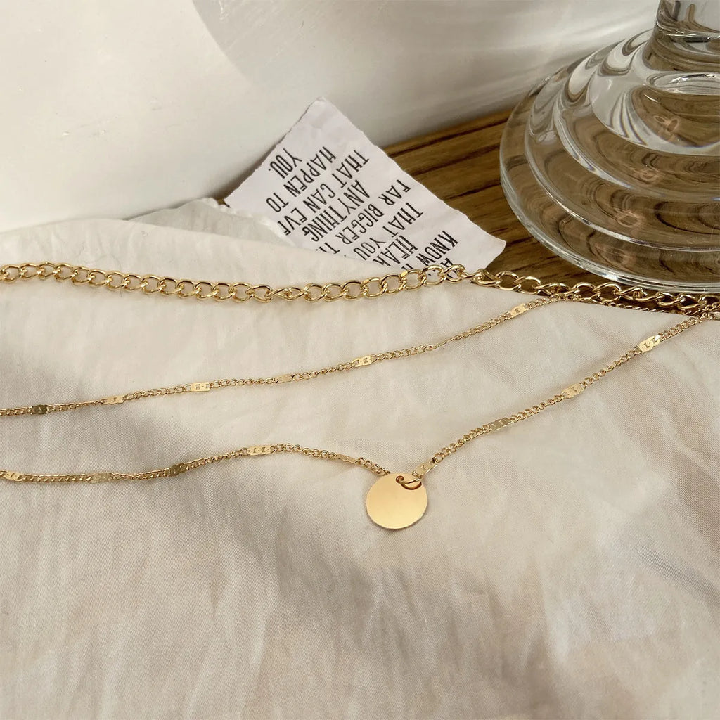 Women's multilayer disc pendant clavicle necklace in gold and silver alloy finish