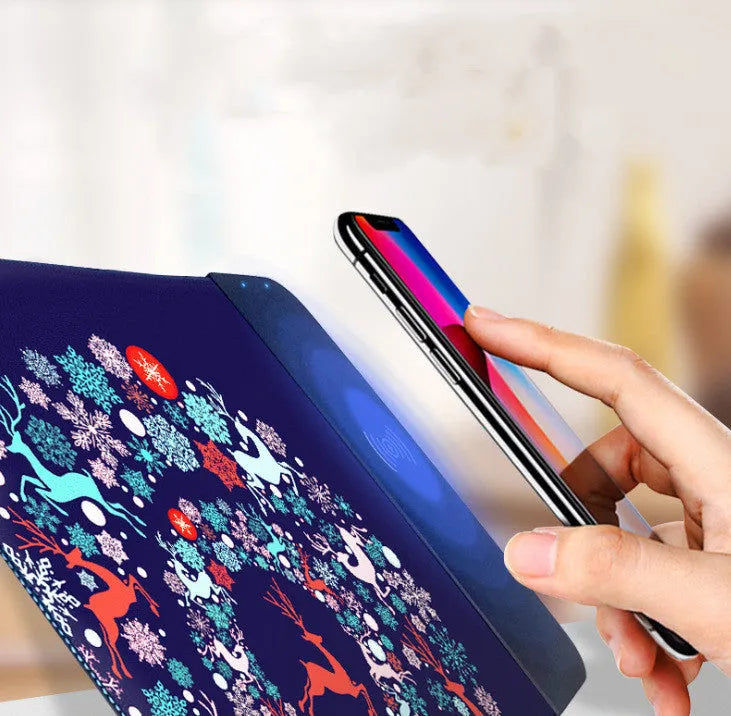 Wireless charging mouse pad with cartoon design and RGB lighting around edges