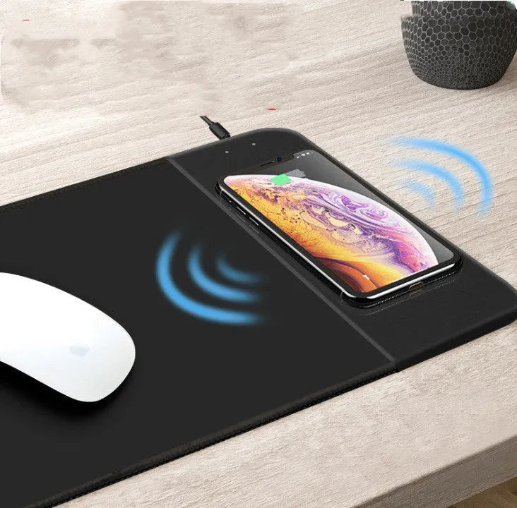 Wireless charging mouse pad with cartoon design and RGB lighting around edges