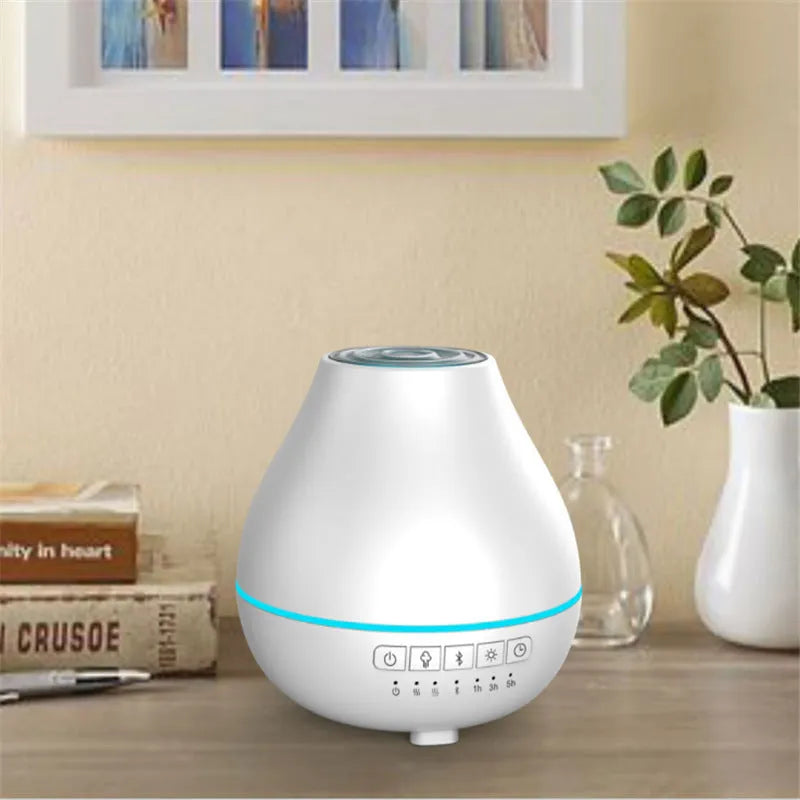 White round Bluetooth humidifier and aroma diffuser with LED night light on wooden surface
