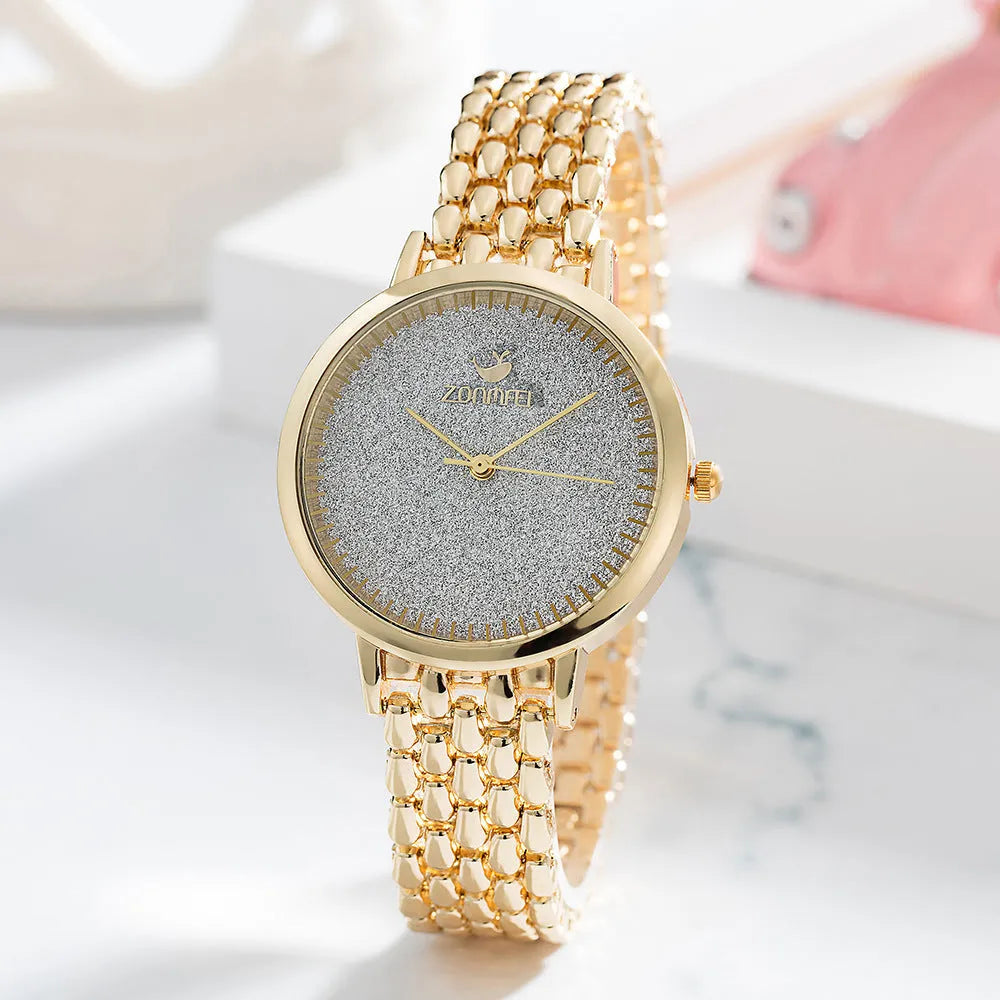Gold women's watch set with earrings ring necklace bracelet on white background