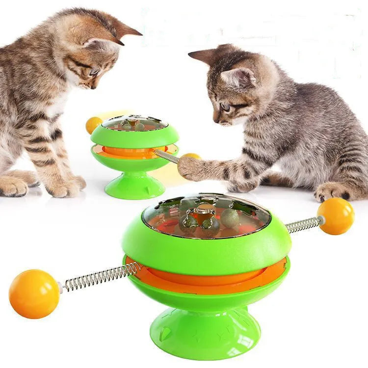 Rotatable cat toy with suction cup base and transparent top containing catnip balls in choice of four colours