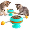Rotatable cat toy with suction cup base and transparent top containing catnip balls in choice of four colours