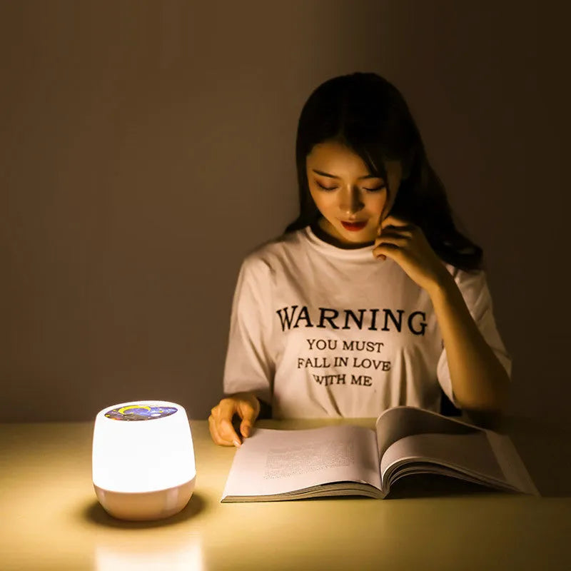 Pruixin PRX1363 rotating LED projector night light displaying star and love patterns on a wall.