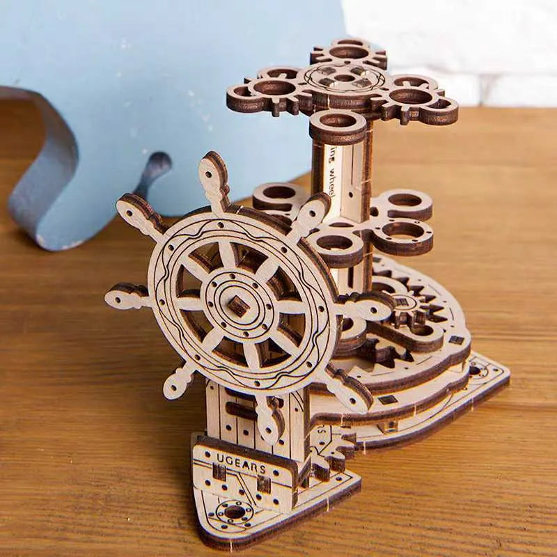 Ukrainian wooden rotating pen holder with steering wheel mechanism on wooden desktop