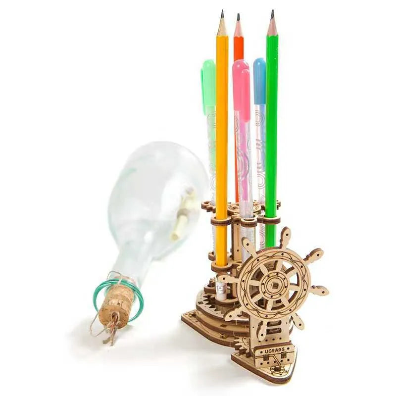 Ukrainian wooden rotating pen holder with steering wheel mechanism on wooden desktop