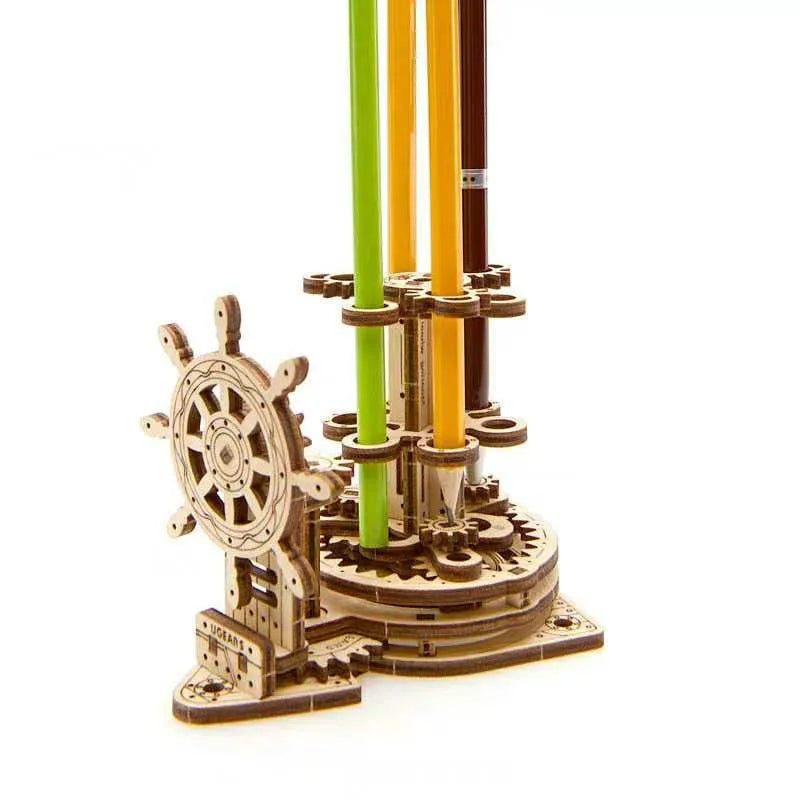 Ukrainian wooden rotating pen holder with steering wheel mechanism on wooden desktop