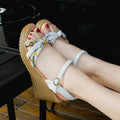 Pink and white women's wedge sandals with a thick platform sole and a single adjustable buckle strap.