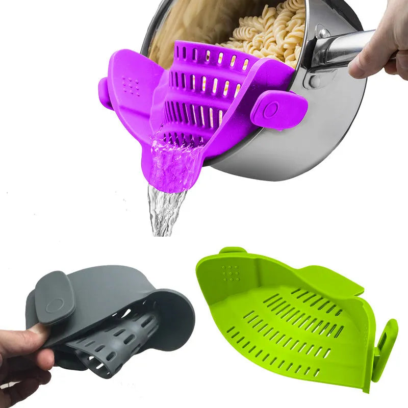 Silicone clip-on colander with stainless steel buckle attached to a pot, draining liquid, available in four colours.