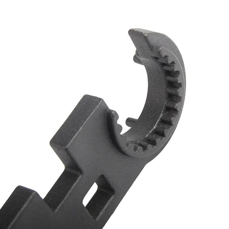 Black steel multi-function combination wrench for AR-15 and M4 rifles on a plain background.