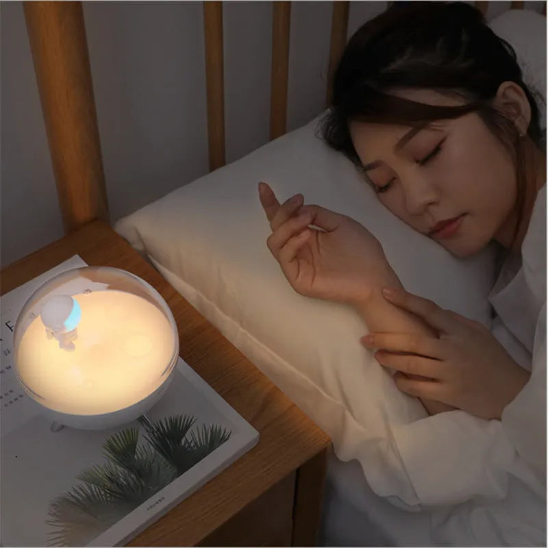 USB-powered cartoon-style LED night light in modern white or blue colour with button switch