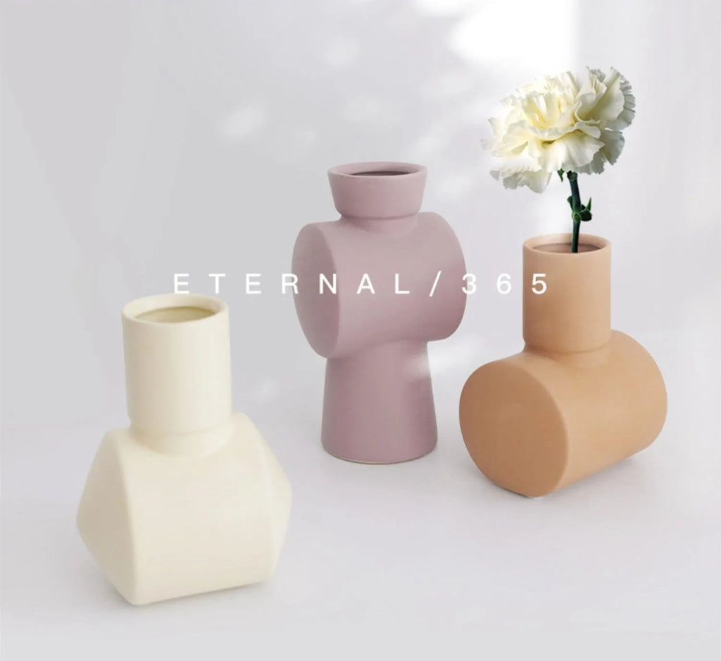 Nordic Morandi simple hammer ceramic vase in beige, brown, or purple glaze colours.