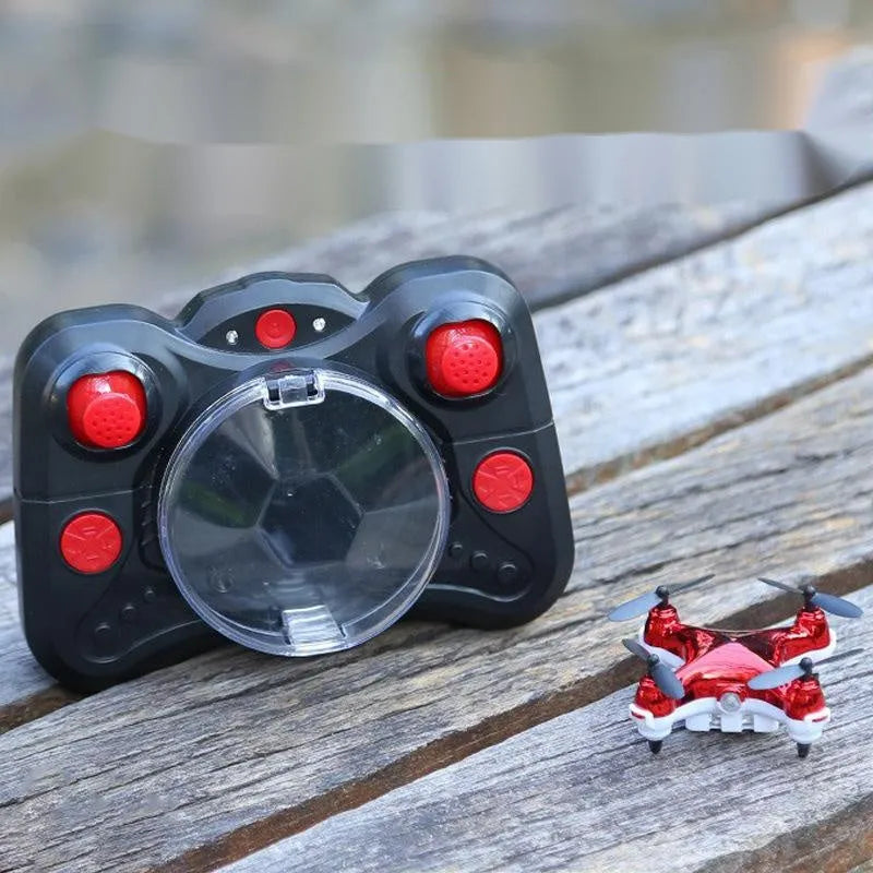 Compact bright gold fixed height remote control quadcopter aircraft with four blades and a handle-style remote.
