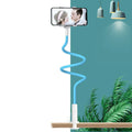 Memory alloy mobile phone holder positioned at bedside with universal adjustment for phones and tablets