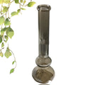 Clear geometric glass vase with stable base on a tabletop.