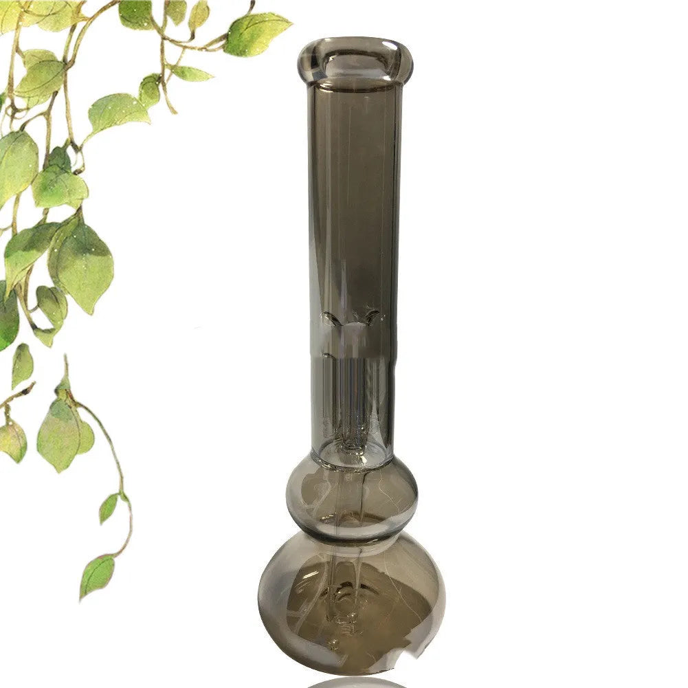 Clear geometric glass vase with stable base on a tabletop.