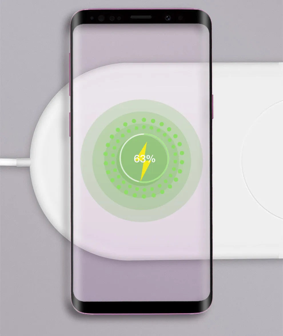 White dual wireless charging pad for two mobile phones on a desk.