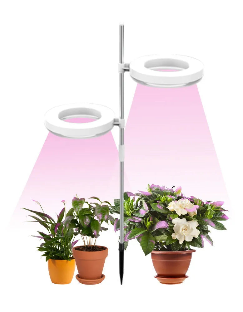 Compact desk plant growth lamp with full spectrum light on a home office workspace.