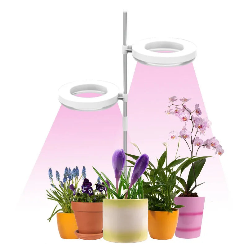 Compact desk plant growth lamp with full spectrum light on a home office workspace.