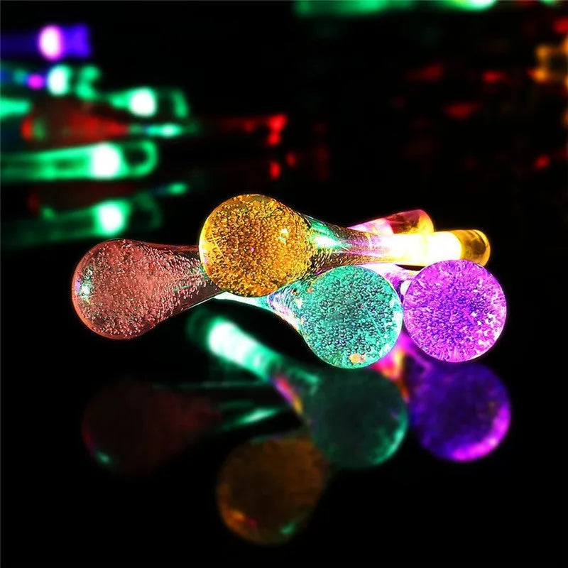 Solar-powered water drops LED string lights for outdoor garden decoration with waterproof design