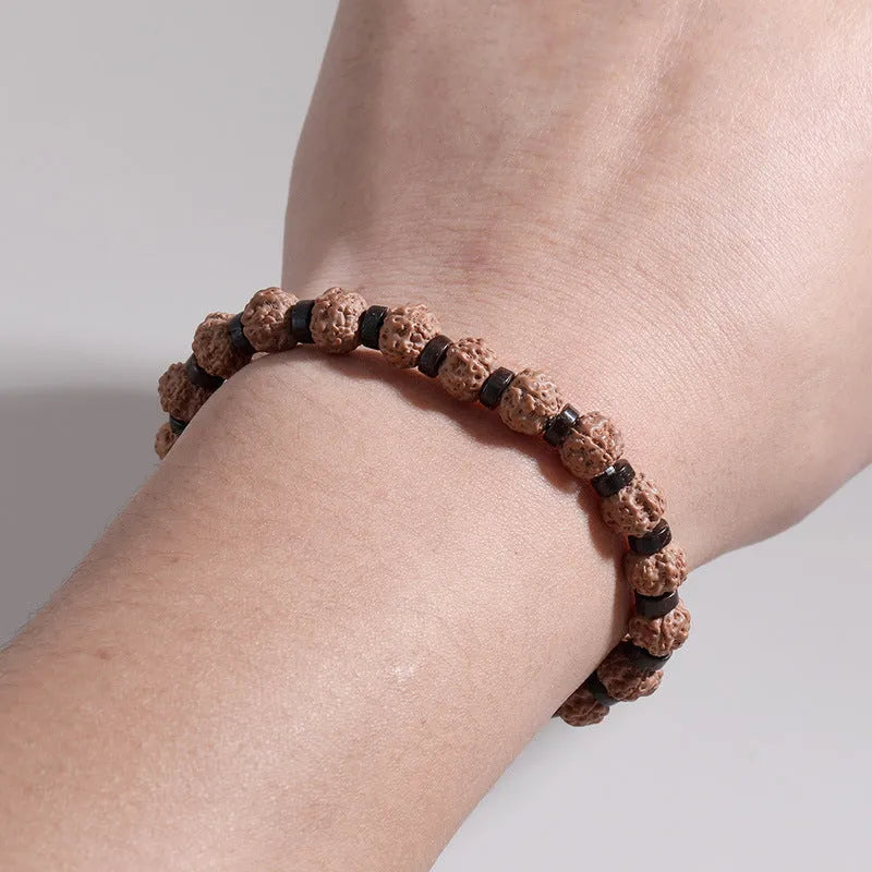 Brown volcanic stone agate beaded bracelet with rope chain on wrist