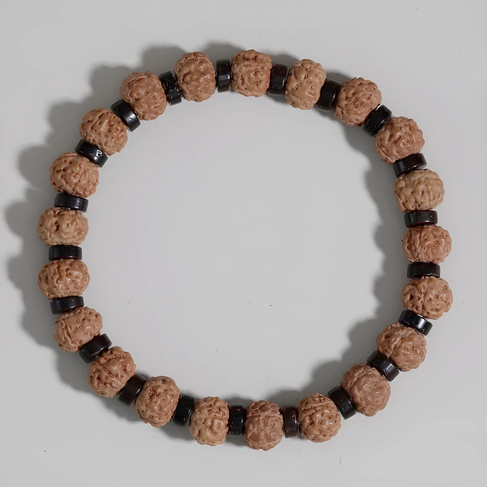 Brown volcanic stone agate beaded bracelet with rope chain on wrist