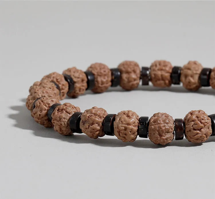 Brown volcanic stone agate beaded bracelet with rope chain on wrist