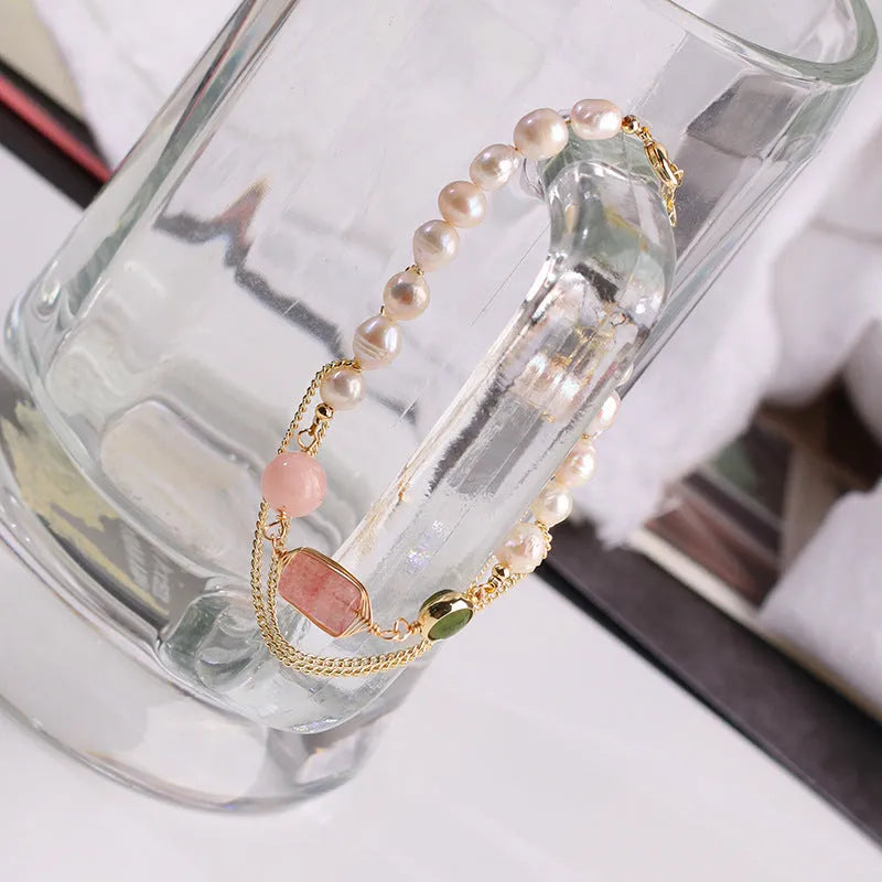 Women's geometric pink freshwater pearl bracelet with strawberry crystal charms.