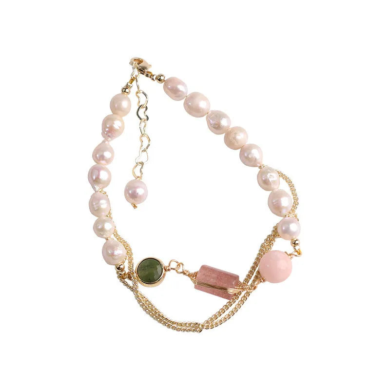 Women's geometric pink freshwater pearl bracelet with strawberry crystal charms.