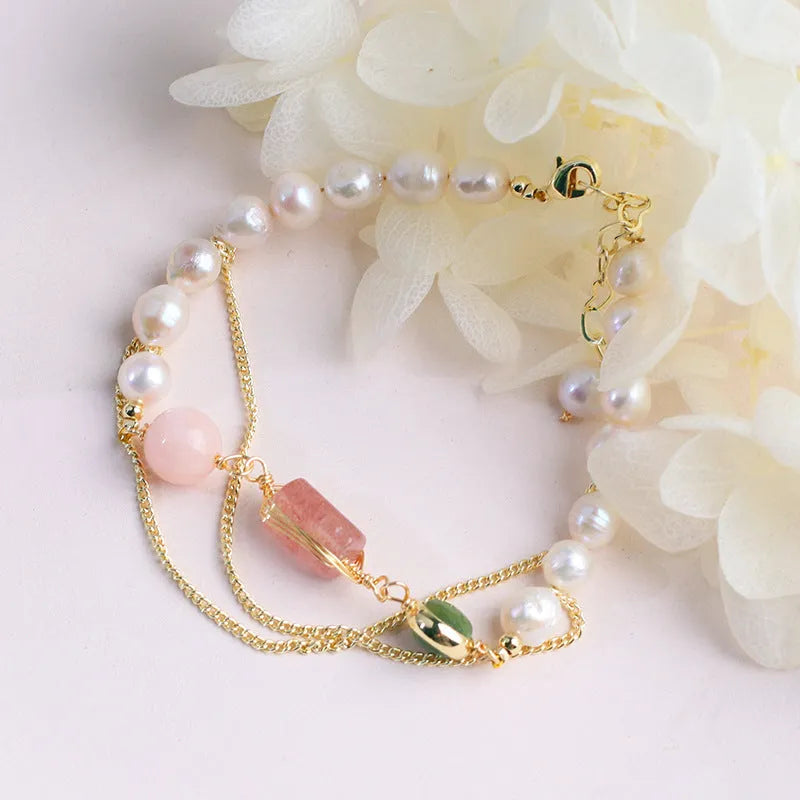 Women's geometric pink freshwater pearl bracelet with strawberry crystal charms.