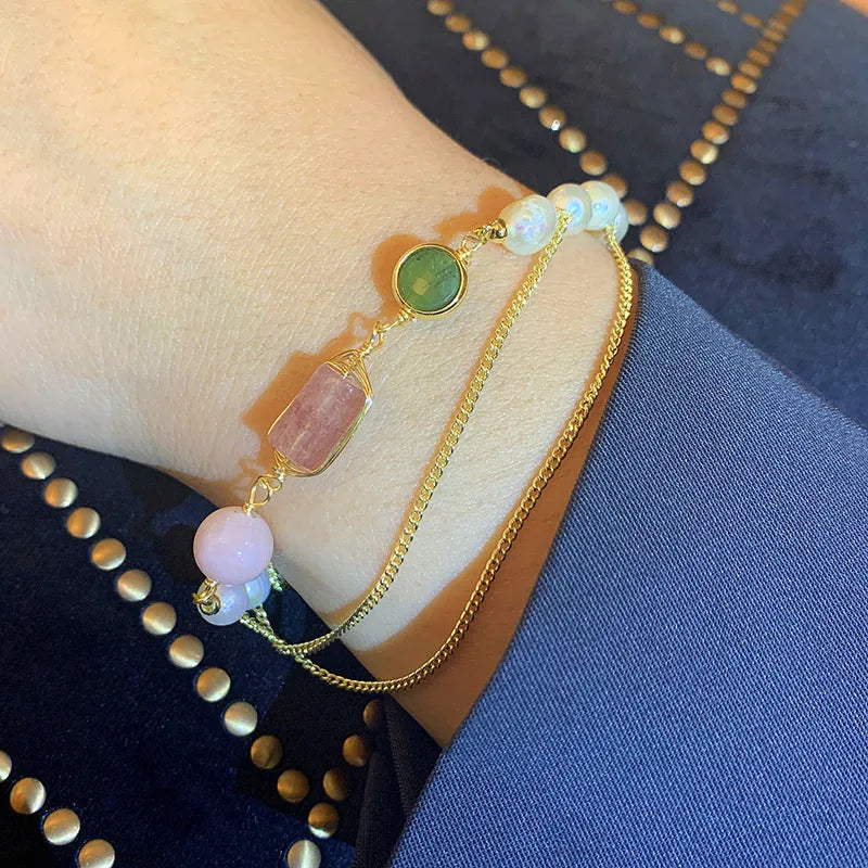 Women's geometric pink freshwater pearl bracelet with strawberry crystal charms.