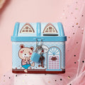 Blue house-shaped tinplate piggy bank with coin slot on desktop