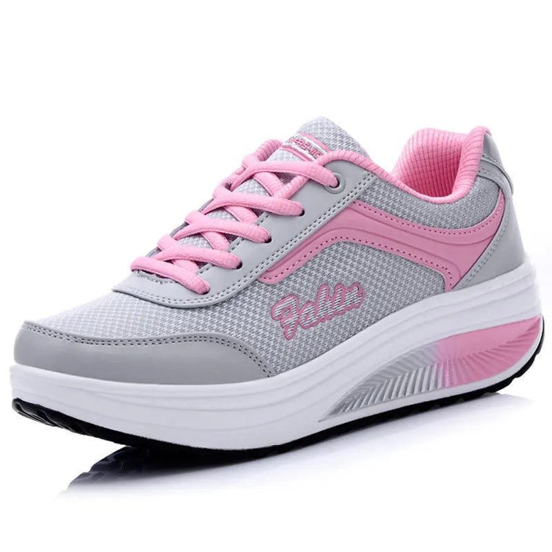 Women's grey heelless sports shoes with a mid-heel, shown alongside black and pink colour options.