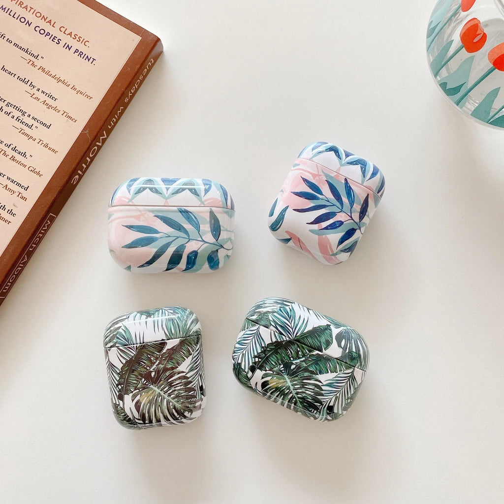 Blue TPU AirPods case cover with a detailed tropical banana leaf pattern.