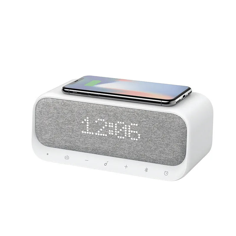 Anker Soundcore white Bluetooth speaker with wireless charging pad and LED clock display