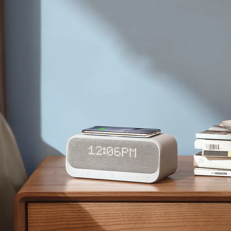 Anker Soundcore white Bluetooth speaker with wireless charging pad and LED clock display