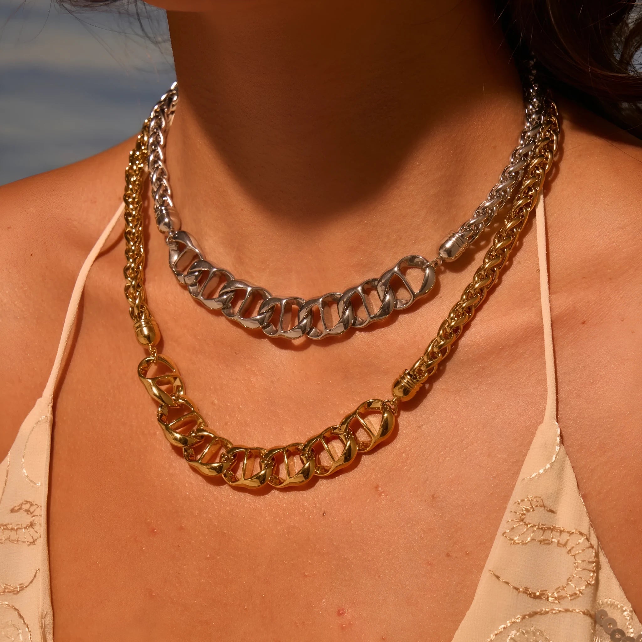 Stainless steel women's necklace with geometric pendant and gold plating