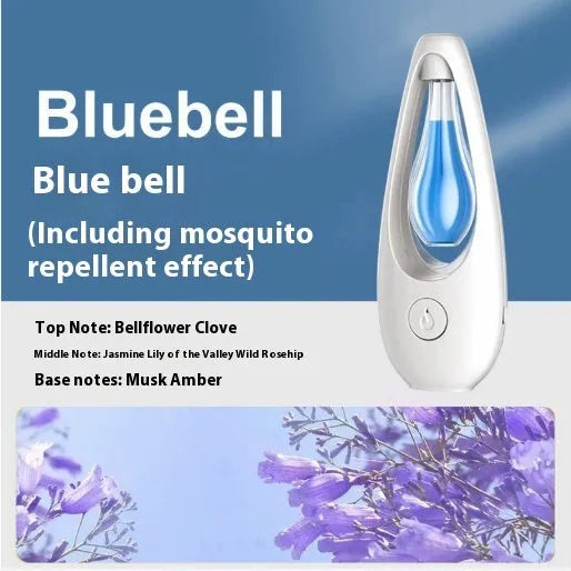 Ultrasonic aroma diffuser with mosquito repellent in a compact plastic design on a table, with essential oil bottle beside it