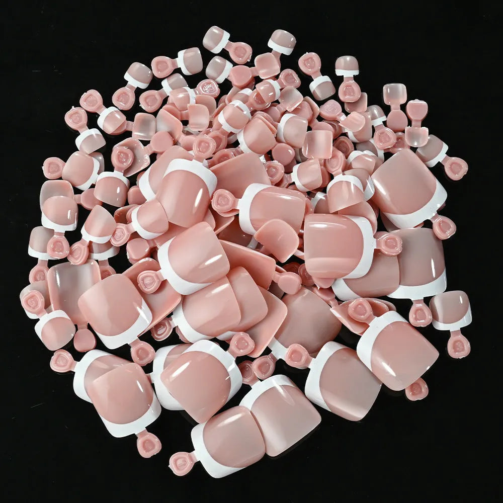 Open box showing 120 full square short French white edge toe nail tips in various nude shades.