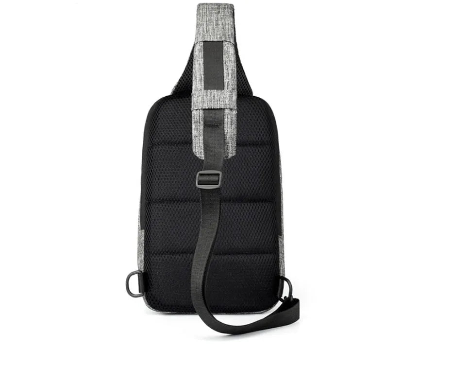 Small dark blue oxford cloth waterproof chest bag with a single strap, shown with the zipper open.