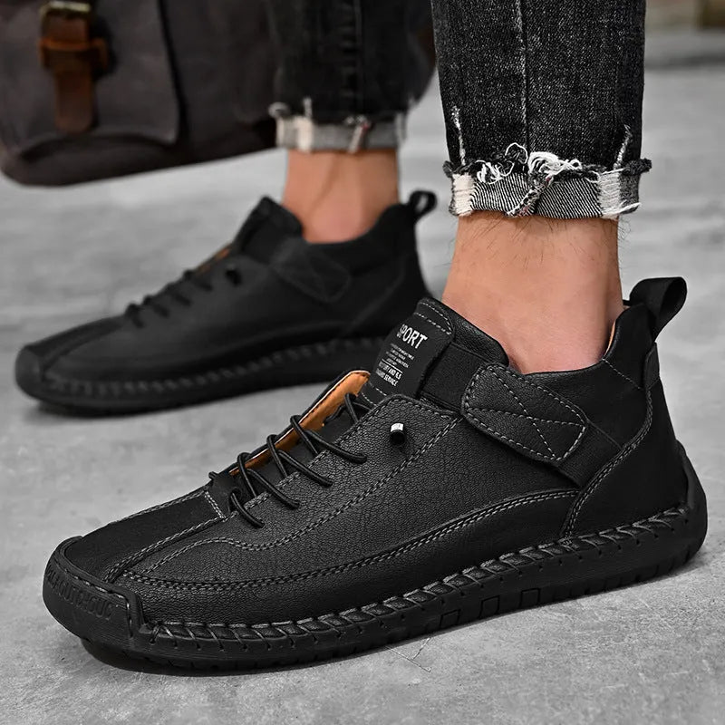 Men's mid-top Martin boot in a solid colour with elastic band, round toe, and tooling stitching on the rubber sole.